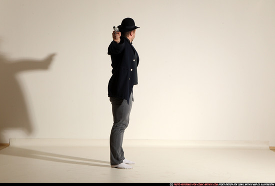 Man Adult Muscular White Fighting with gun Standing poses Coat