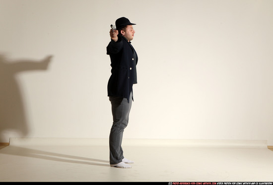 Man Adult Muscular White Fighting with gun Standing poses Coat