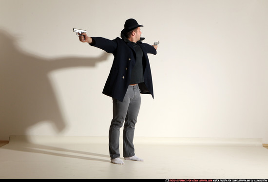 Man Adult Muscular White Fighting with gun Standing poses Coat