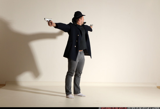 Man Adult Muscular White Fighting with gun Standing poses Coat