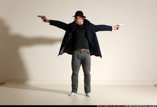 Man Adult Muscular White Fighting with gun Standing poses Coat