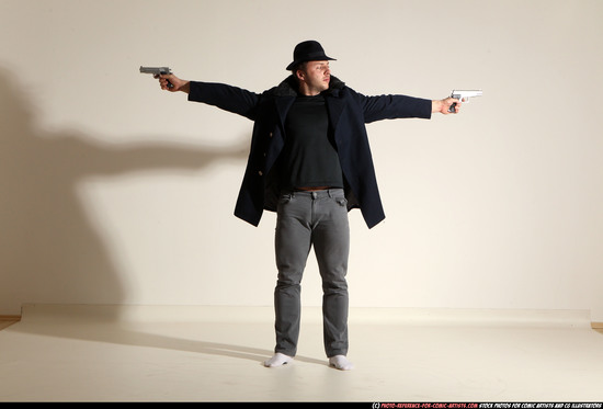 Man Adult Muscular White Fighting with gun Standing poses Coat