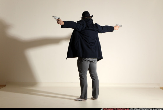 Man Adult Muscular White Fighting with gun Standing poses Coat