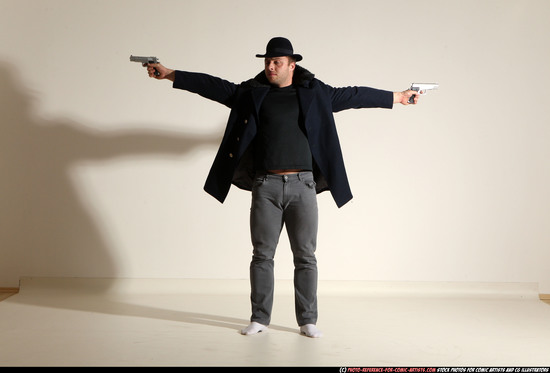 Man Adult Muscular White Fighting with gun Standing poses Coat