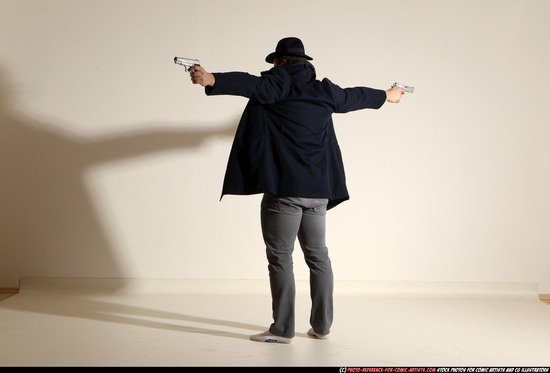 Man Adult Muscular White Fighting with gun Standing poses Coat