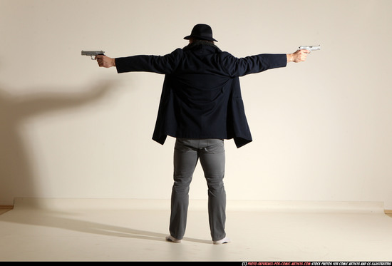 Man Adult Muscular White Fighting with gun Standing poses Coat