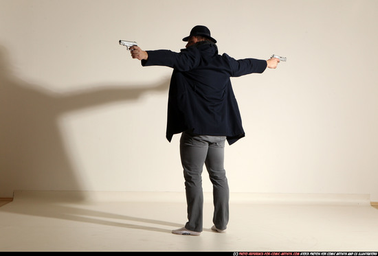 Man Adult Muscular White Fighting with gun Standing poses Coat