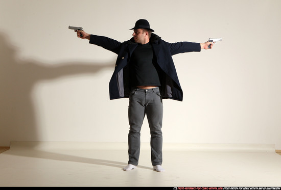 Man Adult Muscular White Fighting with gun Standing poses Coat