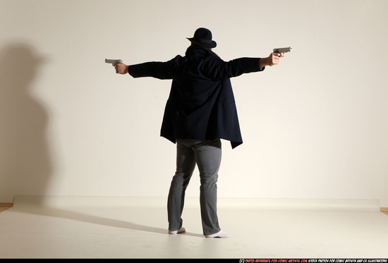 Man Adult Muscular White Fighting with gun Standing poses Coat