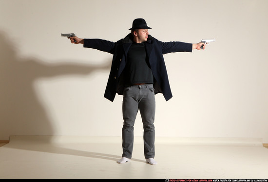 Man Adult Muscular White Fighting with gun Standing poses Coat