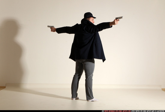 Man Adult Muscular White Fighting with gun Standing poses Coat