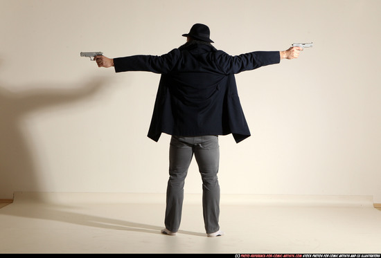 Man Adult Muscular White Fighting with gun Standing poses Coat