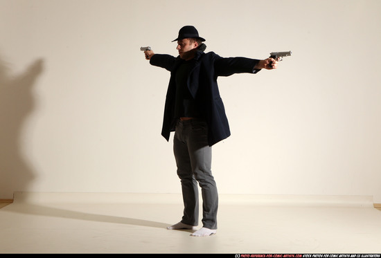 Man Adult Muscular White Fighting with gun Standing poses Coat