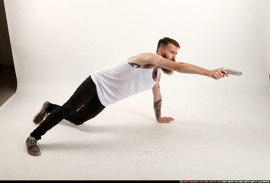 Man Adult Athletic White Fighting with gun Laying poses Casual