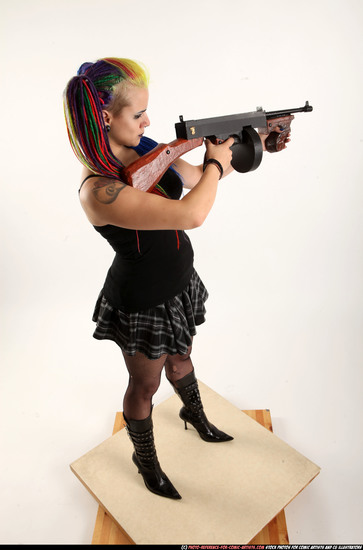 Woman Young Average White Fighting with submachine gun Standing poses Casual