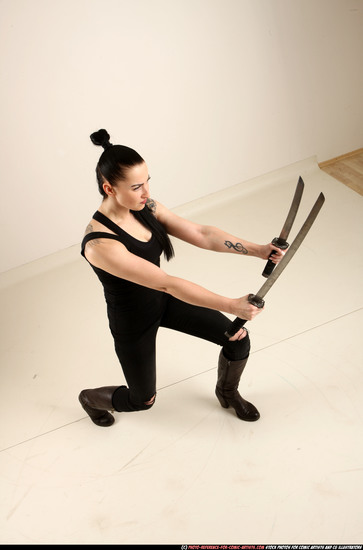 Woman Adult Athletic White Fighting with sword Standing poses Casual