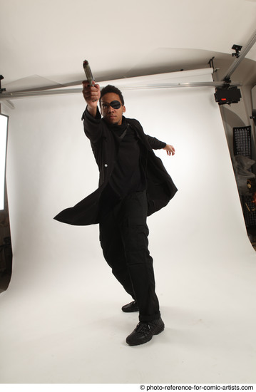 Man Adult Average Black Fighting with gun Standing poses Coat