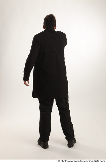 Man Adult Average Black Fighting with gun Standing poses Coat