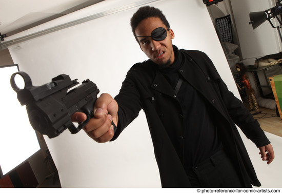 Man Adult Average Black Fighting with gun Standing poses Coat