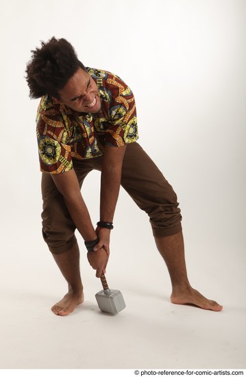 Man Adult Average Black Fighting with hammer Crouching Coat