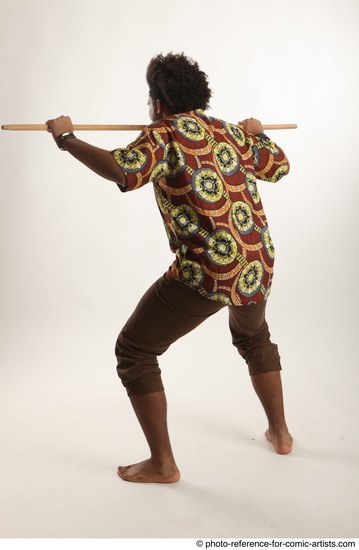 Man Adult Average Black Fighting with spear Standing poses Coat