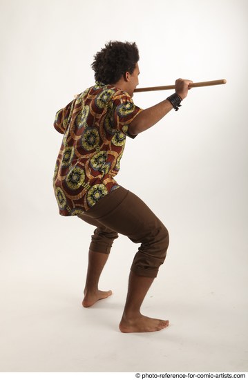 Man Adult Average Black Fighting with spear Standing poses Coat