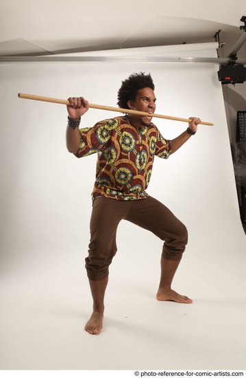 Man Adult Average Black Fighting with spear Standing poses Coat