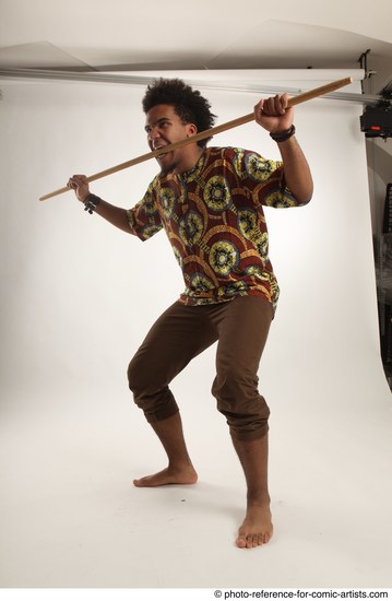 Man Adult Average Black Fighting with spear Standing poses Coat