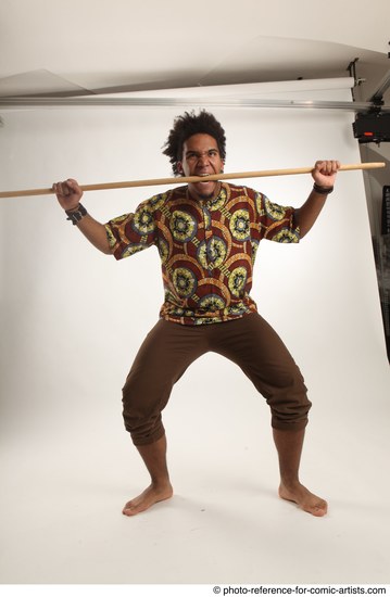 Man Adult Average Black Fighting with spear Standing poses Coat