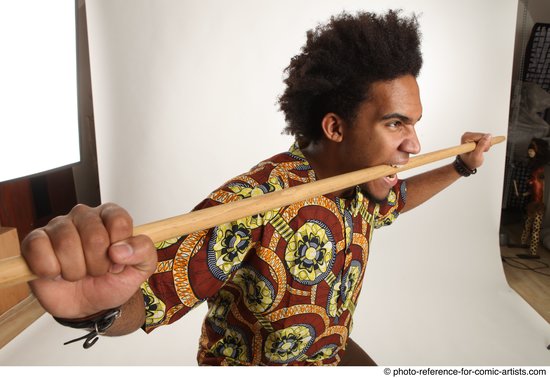 Man Adult Average Black Fighting with spear Standing poses Coat