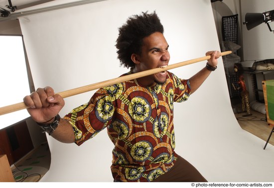 Man Adult Average Black Fighting with spear Standing poses Coat