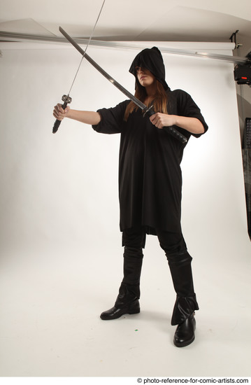 Woman Adult Average White Fighting with sword Standing poses Coat