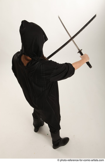 Woman Adult Average White Fighting with sword Standing poses Coat