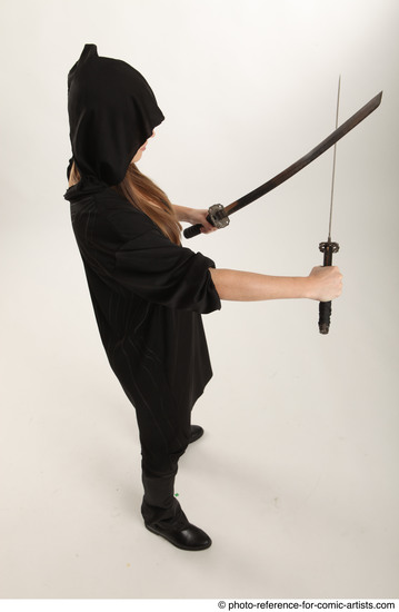 Woman Adult Average White Fighting with sword Standing poses Coat