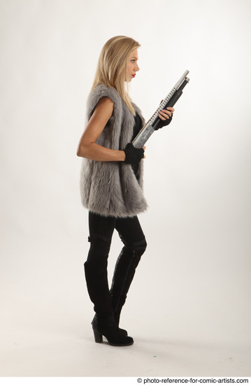 Woman Adult Average White Fighting with gun Standing poses Coat