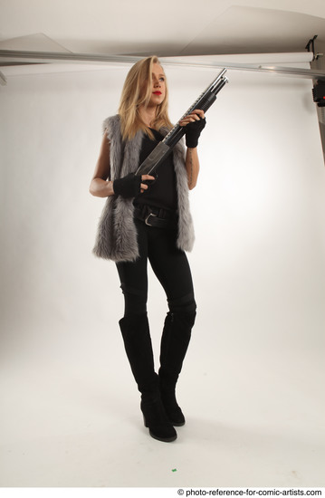 Woman Adult Average White Fighting with gun Standing poses Coat