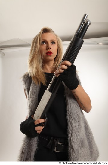 Woman Adult Average White Fighting with gun Standing poses Coat