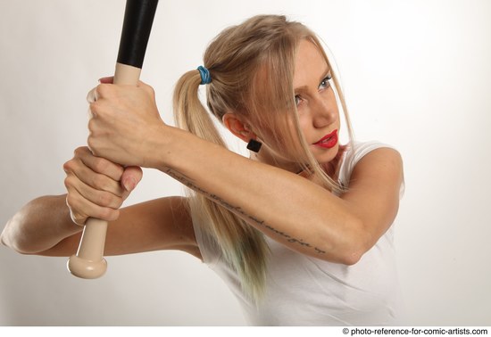 Woman Adult Average White Standing poses Coat Fighting with bat