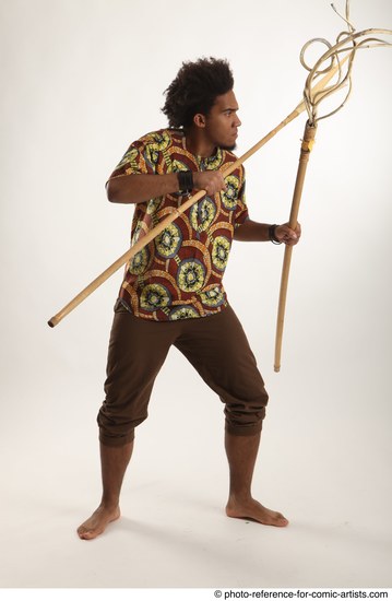 Man Adult Average Black Fighting with spear Standing poses Coat