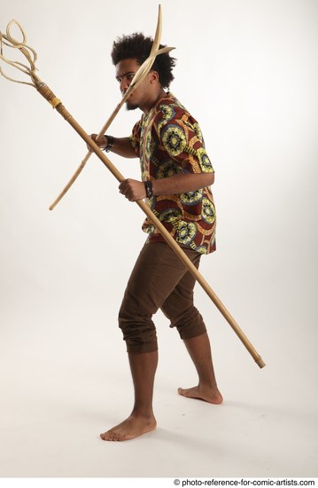 Man Adult Average Black Fighting with spear Standing poses Coat