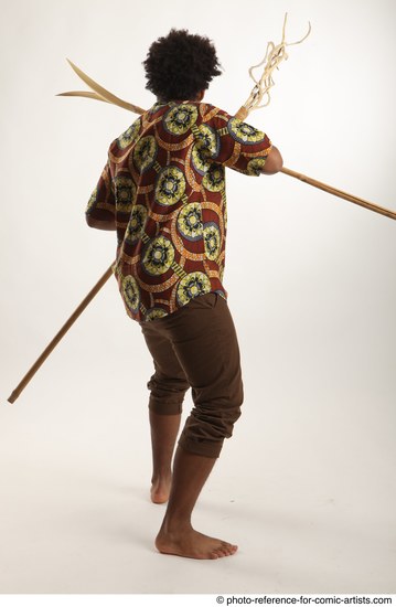 Man Adult Average Black Fighting with spear Standing poses Coat