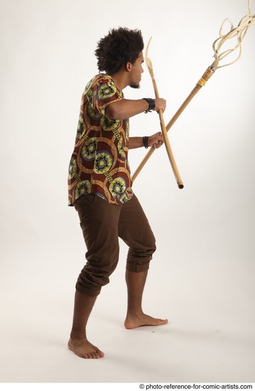 Man Adult Average Black Fighting with spear Standing poses Coat