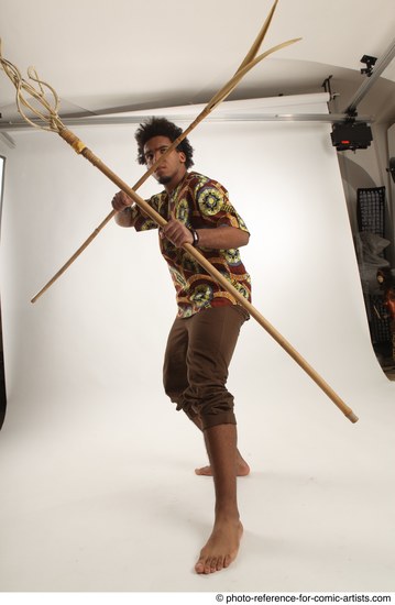 Man Adult Average Black Fighting with spear Standing poses Coat