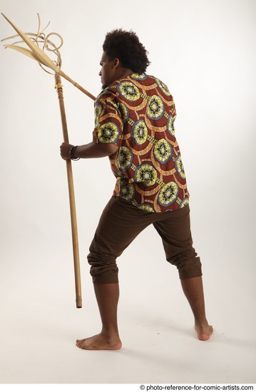 Man Adult Average Black Fighting with spear Standing poses Coat