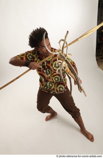 Man Adult Average Black Fighting with spear Standing poses Coat