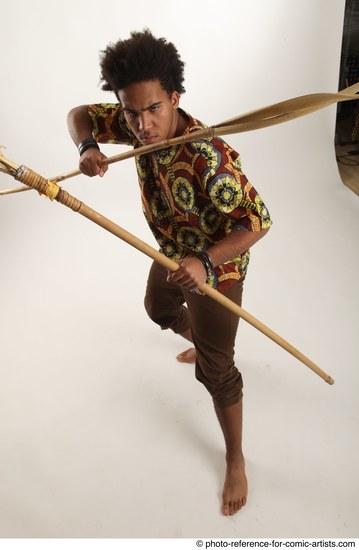 Man Adult Average Black Fighting with spear Standing poses Coat