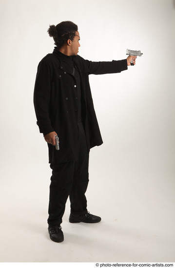 Man Adult Average Black Fighting with gun Standing poses Coat