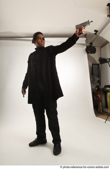 Man Adult Average Black Fighting with gun Standing poses Coat