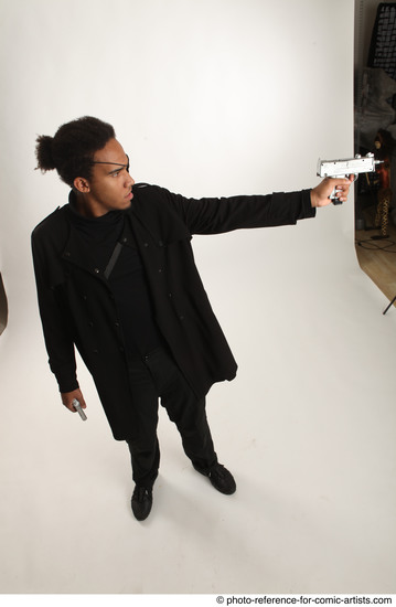 Man Adult Average Black Fighting with gun Standing poses Coat