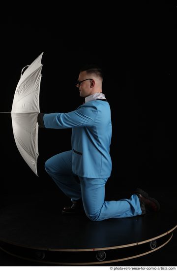 Man Adult Muscular White Fighting without gun Kneeling poses Business